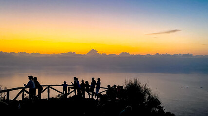 People are watching the eruptions on Stromboli vulcano at Aeolian Islands, Italy.
