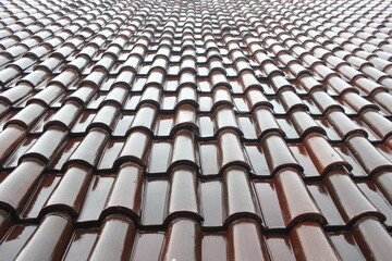 Glossy brown roof tiles. Roof tiles background