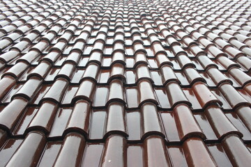 Glossy brown roof tiles. Roof tiles background