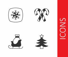 Set Christmas tree, Snowflake, santa claus sleigh and Candy cane with stripes icon. Vector