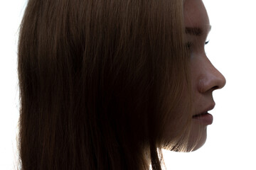 A portrait of a young woman against a white background.