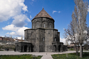 Fototapeta na wymiar The stone Drum Dome Mosque with its conical tower is a landmark in a residential neighborhood of Kars, Eastern Anatolia, Turkey