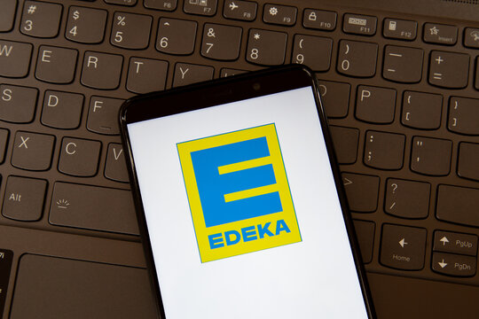 Toronto, ON, Canada - December 19, 2021: Edeka logo on the smartphone screen on a keyboard. The Edeka Group is the largest German supermarket corporation.