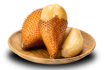 Pile of salak fruit in wooden plate isolated on white background.