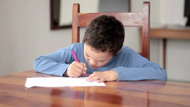 boy with school work at home not going back to school due to coronavirus stock video