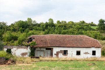 Panorama of an abandoned farm of Central Serbia in an agricultural landscape. The region of Balkans...