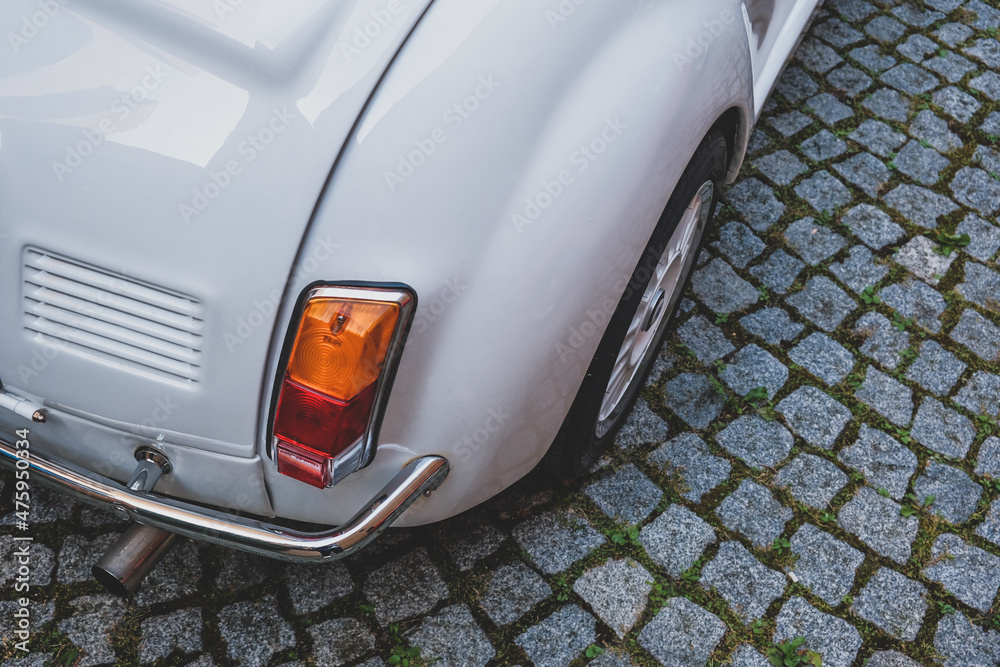 Sticker High angle shot of a  white oldtimer cabrio car backlight