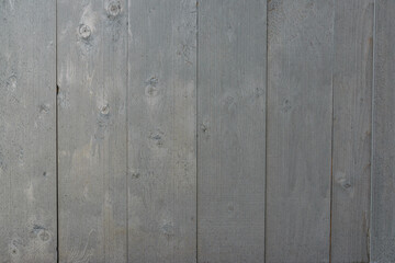 Grey painted wooden planks. Texture of weathered gray painted boards of wall, table or fence, high resolution.