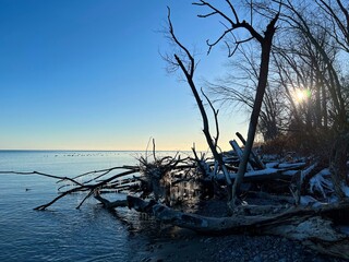 Sun setting on cold lake in winter