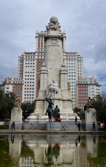 Fototapeta na wymiar Madrid, Spain - Sept. 28, 2013: Vertical view of the Monument to Miguel de Cervantes, a stone monolith with several statues, including Cervantes', in the center of the Plaza de España.