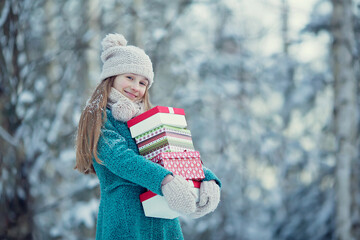 Girl with Christmas gift on a winter walk