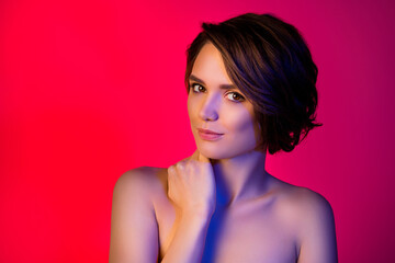 Photo of pretty short hairdo young lady touch skin without clothes isolated on vibrant red color background