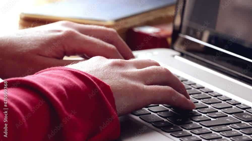 Sticker a closeup shot of female hands typing on laptop keyboard in hd