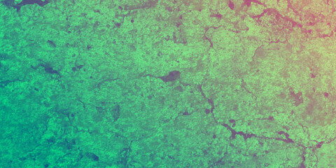 A large fragment of the yellow clay wall of the old house with cracks and roughness, exfoliating part of the plaster. Vintage background. Rough flushed texture. Wall green color texture background old