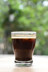 a cup of arabica coffee ready to be enjoyed with a blur background