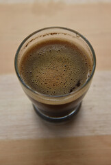 a cup of arabica coffee ready to be enjoyed with a blur background