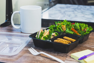 Lunch salad on desktop, office ambient healthy food