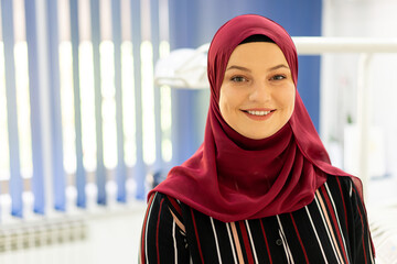 Muslim Middle Eastern girl inside dentist office