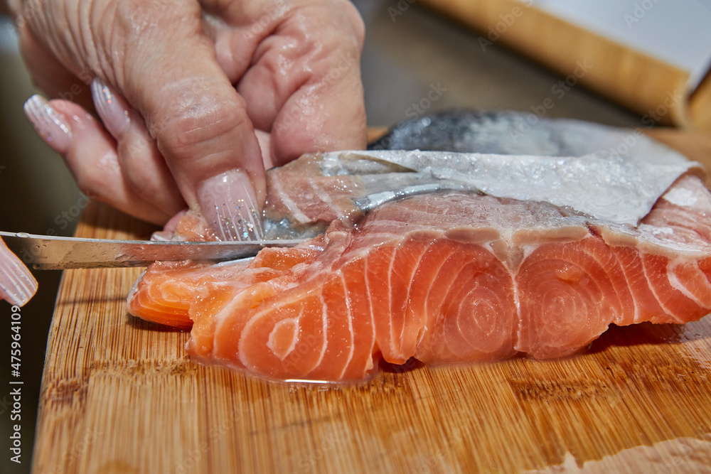 Canvas Prints Chef is skinning salmon fillets for cooking