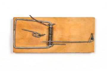 A wooden mousetrap on a white background.