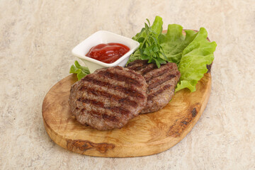 Grilled beef burger cutlet with sauce