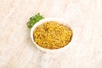 Grain mustard sauce in the bowl