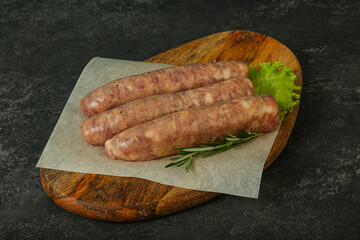 Raw pork meat sausages for grill