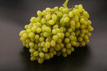 Green grape branch over background