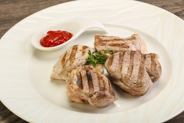 Grilled pork tenderlion with tomato sauce
