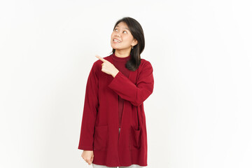 Pointing Product Aside Of Beautiful Asian Woman Wearing Red Shirt Isolated On White Background