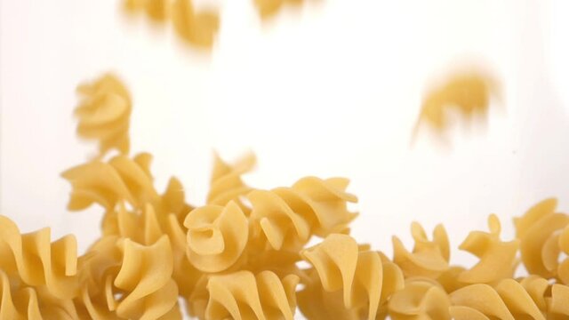 pasta falls in slow motion and covers the whole screen