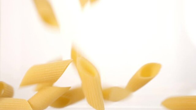 pasta falls in slow motion and covers the whole screen