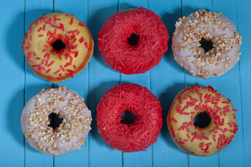 Six donuts on a blue background