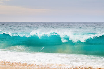 Powerful ocean blue waves with white foam. Marine landscape..