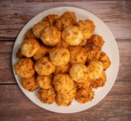 Rocher coco from coconut dessert in brown color make with white eggs and sugar.