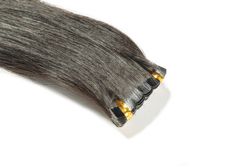 close up of tape in adhesive virgin remy straight black human hair extensions