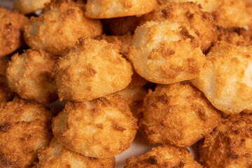 Rocher coco from coconut dessert in brown color make with white eggs and sugar.
