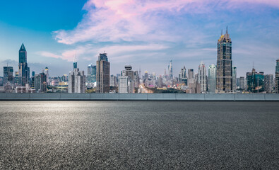 Obraz premium Panoramic skyline and modern commercial buildings with empty road in Shanghai