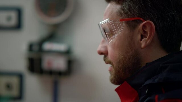 Emergency medical technician talking with colleague in ambulance car