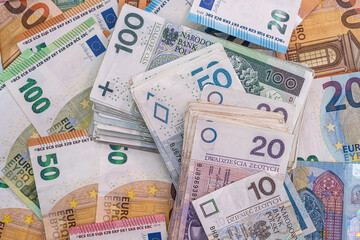 Fototapeta na wymiar pile of polish banknotes zlotys and euros