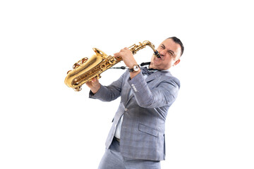 Expressive musician man in a suit plays on saxophone isolated on white background