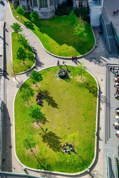 Overhead arrial view of people gatherings in the city park.