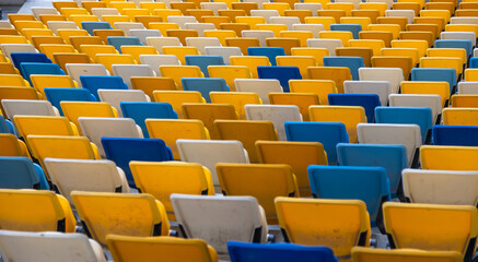 Fototapeta premium empty colorful seats on tribunes of stadium