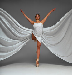 Ballerina Dancing with Silk Fabric, Modern Ballet Dancer in Fluttering Waving Cloth, Pointe Shoes, Gray Background