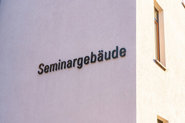 White wall of a university building with the German inscription for seminar building