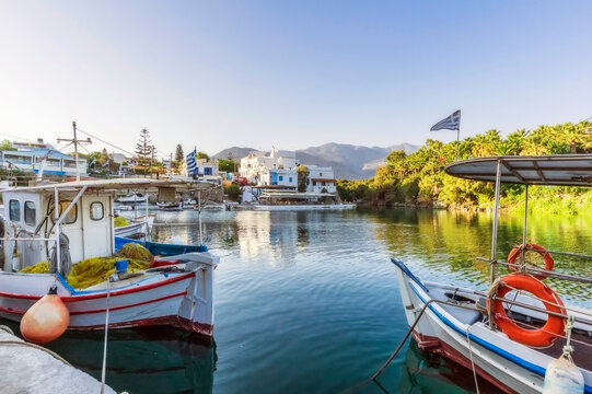 Greece, Crete, Sissi, Boats moored in marina of coastal village