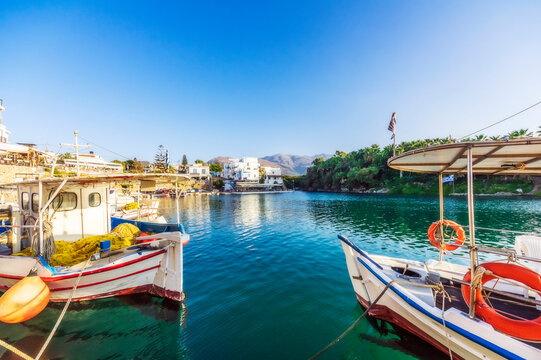 Greece, Crete, Sissi, Boats moored in marina of coastal village
