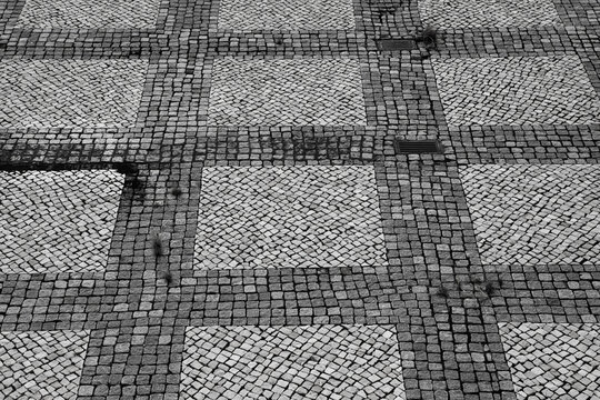 Checked pattern on paved surface