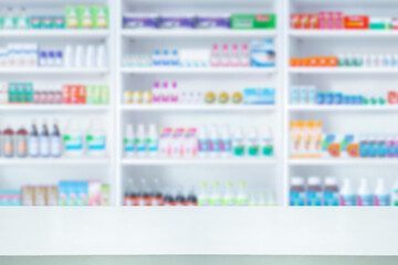 Empty white counter with pharmacy drugstore shelves blurred background - obrazy, fototapety, plakaty