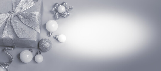 Beautiful Christmas gift boxes. Colored Presents for Birthdays. Boxes with gifts tied with ribbon and bows background. craft paper present box. Christmas tree toys and lights. happy new year 